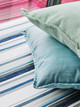 Cushions in Maroma Turchese and Lattice Verde on Olas Azzurro